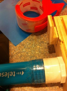 Connecting the vacuum to the table with packing tape